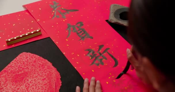 Calligraphy with red spring couplet — Stock Video