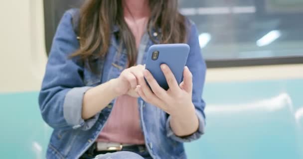 Woman use smartphone on mrt — Stock Video