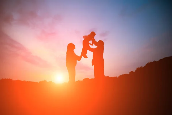 Silhouette of parent play with kid — 스톡 사진