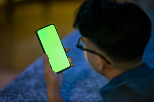 Back View Asian Young Man Watch Smart Phone Green Screen — Stock Photo, Image