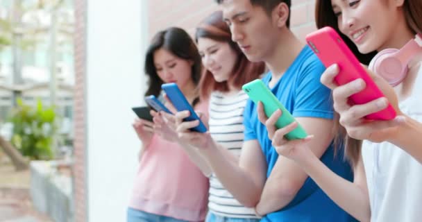 Young students use smartphone — Stock Video