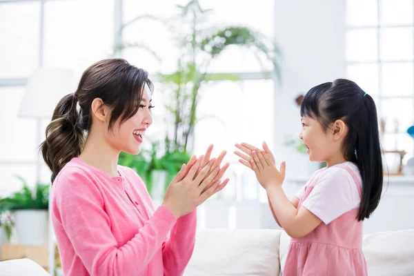 Mom teach child how to wash hands in a right way to avoid covid-19 at home