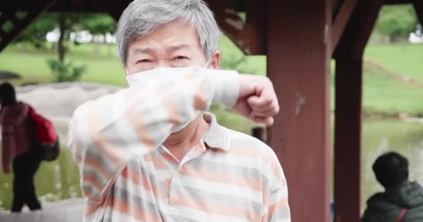 Asian man cough in elbow — Stock Video