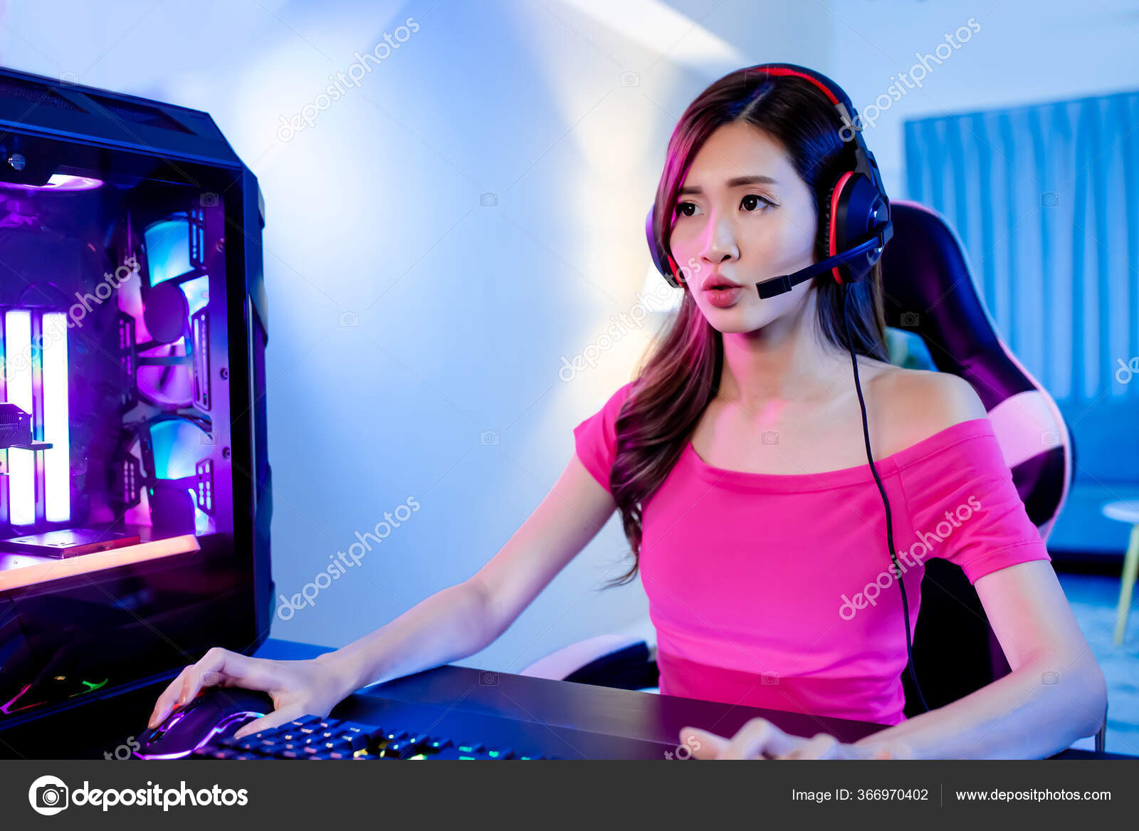 Pro Player Gamer Young Asian Woman Playing Online Video Game Shooting Fps  Tournament Ranking Cyber Internet At Night Red Neon Light Room With Gaming  Headset And Keyboard On Championship Event Stock Photo 