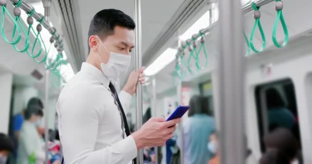 Man with mask in mrt — Stock Video