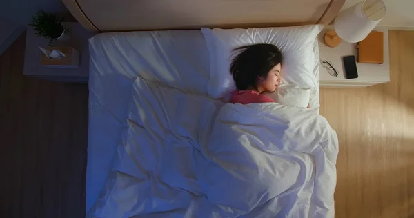 overlooking of asian woman sleep well with smile at night