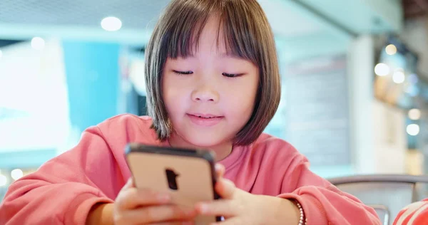 Asian Kid Play Cell Phone At The Restaurant Happily Stock Images Page Everypixel