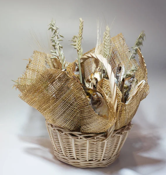 Wicker basket with dried salted fish bouquet of fish