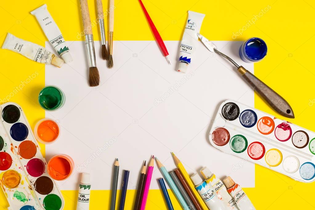 Paints brushes pencils