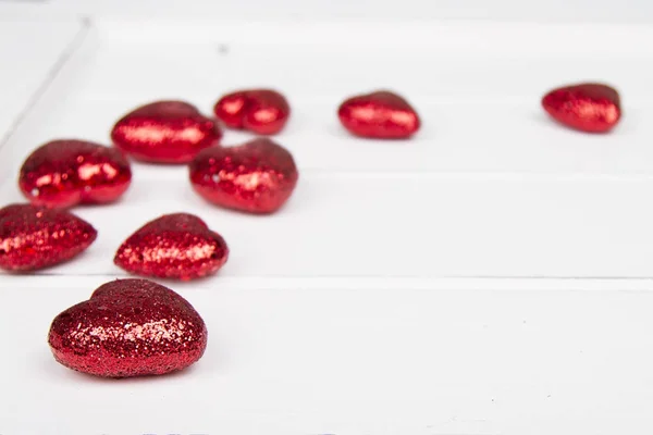 Red Glitter Hearts White Wooden Background — Stock Photo, Image