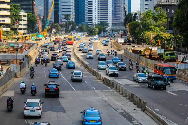 JAKARTA, INDONESIA - February 8th, 2020: High volume traffic at Sudirman business district street in South Jakarta, Indonesia