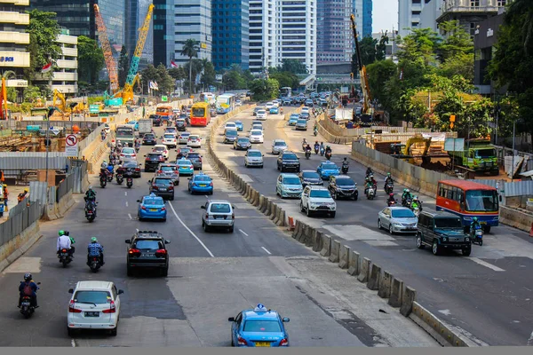 JAKARTA, INDONESIA - February 8th, 2020: High volume traffic at Sudirman business district street in South Jakarta, Indonesia