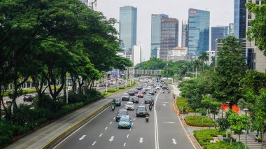 JAKARTA, INDONESIA - February 8th, 2020: High volume traffic at Sudirman business district street in South Jakarta, Indonesia