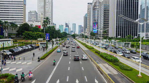 JAKARTA, INDONESIA - February 8th, 2020: High volume traffic at Sudirman business district street in South Jakarta, Indonesia