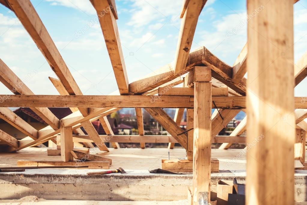 Domestic roof construction details with truss system and exterior beam