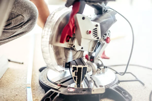 Close up details of worker using professional tools, industrial machinery and tools for cutting metal — Stock Photo, Image