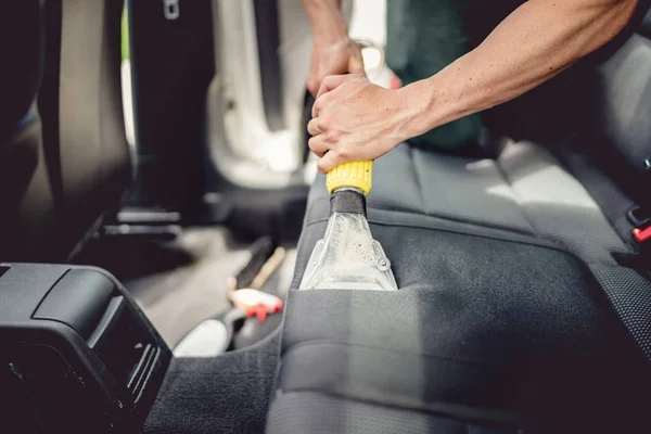 Car detailing and car care concept - Professional using steam vacuum for draining stains — Stock Photo, Image