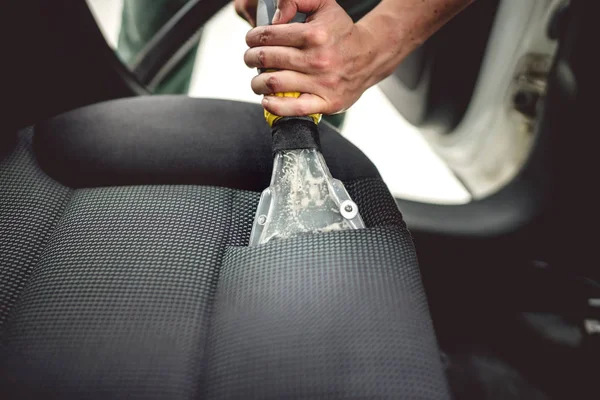 Detailing on interior of modern car. Details of upholstery vacuuming — Stock Photo, Image
