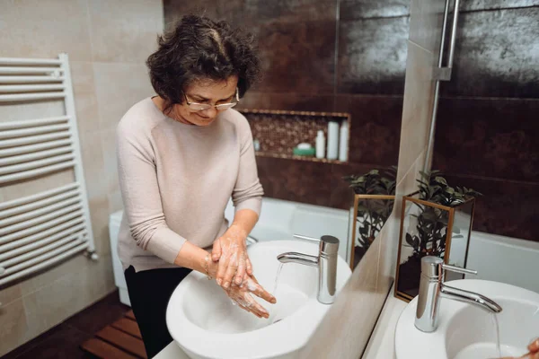 Elderly Woman Carefully Washing Hands Soap Sanitiser Home Bathroom Top — Stock Photo, Image