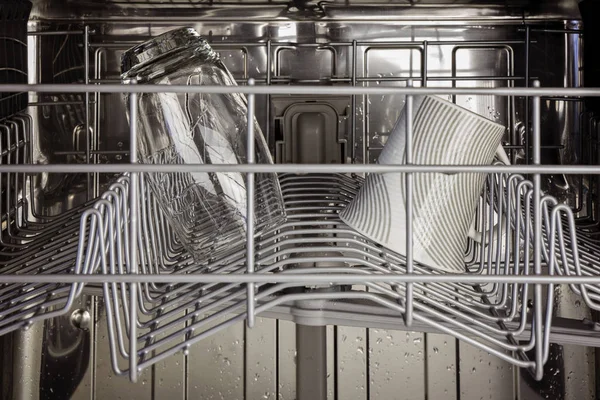 The interior of the top rack of a dishwasher — Stock Photo, Image