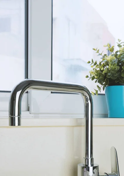 Chrome plated faucet in the kitchen — Stock Photo, Image