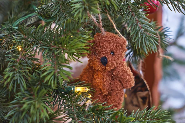 Closeup ornamental toy bear hanging on Christmas tree — Stock Photo, Image