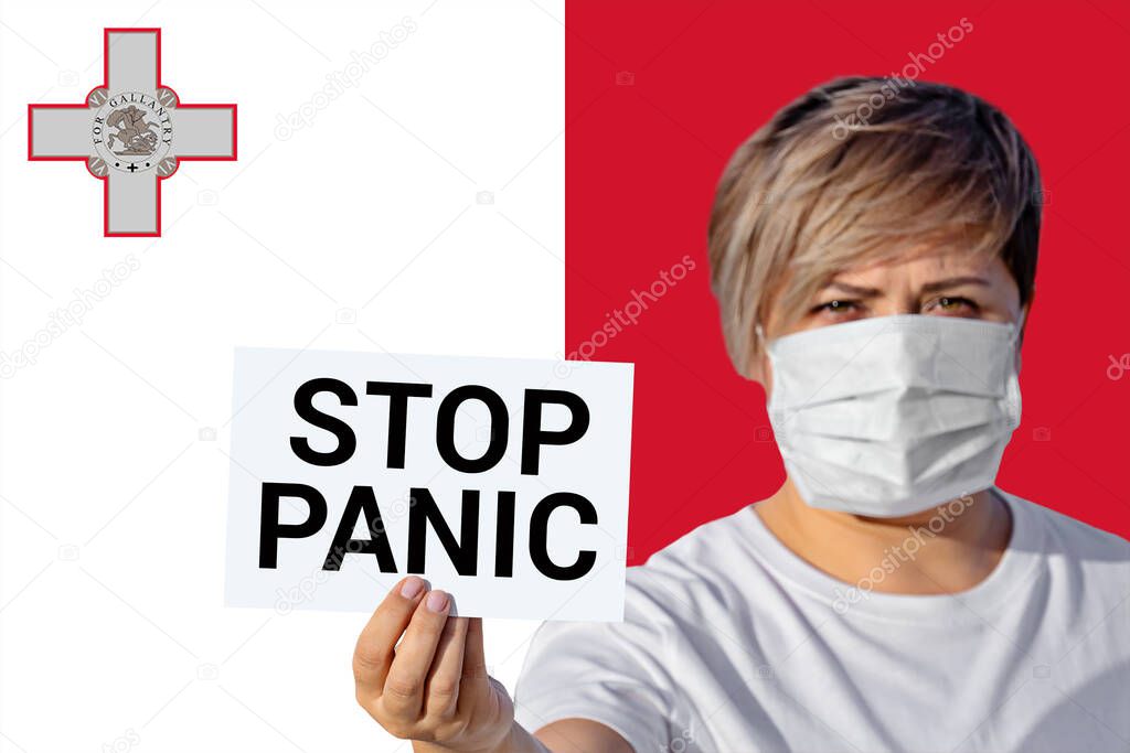 Woman in face mask hold sheet with inscription STOP PANIC against Maltese flag. Concept of spread fake news and misinformation spreads online about Coronavirus COVID-19 in social media in Malta