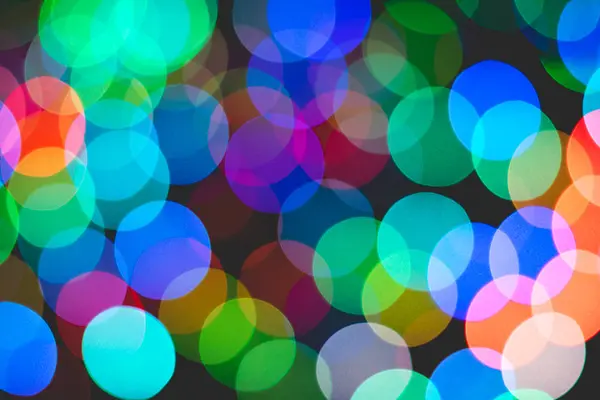 Bunte Bokeh von Licht auf schwarzem Hintergrund. — Stockfoto