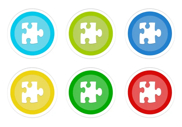 水色と赤の色でパズル シンボルと丸いカラフルなボタンのセット — ストック写真