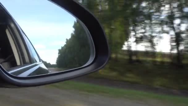 View of the road in the rearview mirror of a car — Stock Video