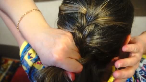 Woman braids pigtails herself, slow motion — Stock Video