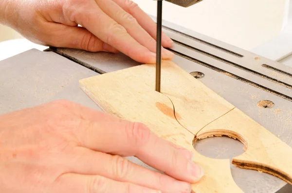 Closeup Womans Hands Working Bandsaw Cut Intricate Shape Piece Plywood — Stock Photo, Image