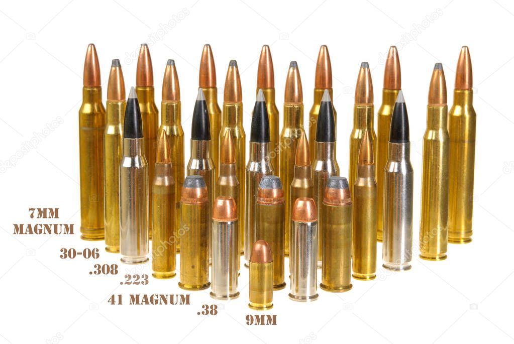 Ammunition of various types and sizes from 320 Auto to 300 Win Mag, arranged in the form of a triangle, isolated on white