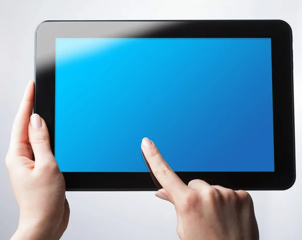 stock image Top view of digital tablet.The girl is holding a tablet with a b