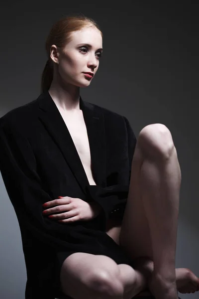 Fashion art studio portrait of elegant girl in geometric black a
