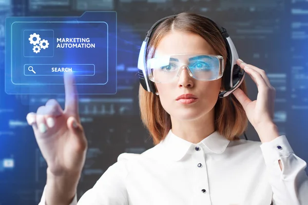 Young businesswoman working in virtual glasses, select the icon marketing automation on the virtual display — Stock Photo, Image