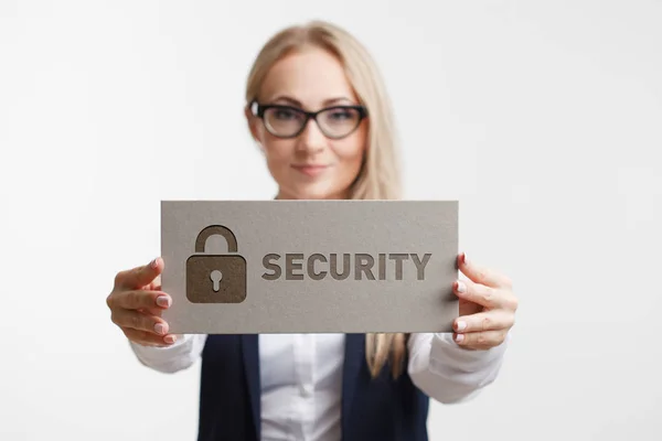 Business, Technology, Internet and network concept. Young girl holding a sign with an inscription security — Stock Photo, Image