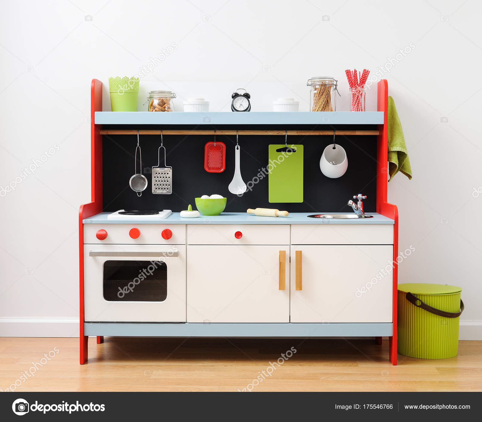 Colorful play kitchen with kitchen utensils ready for children play