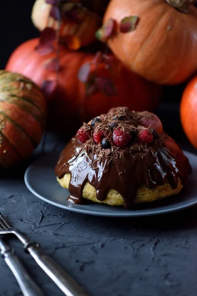 Hygge autumn dessert. Homemade pumpkin pudding with chocolate an