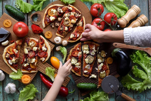 Vegetarian pizza party concept. Flat lay of homemade pizzas with