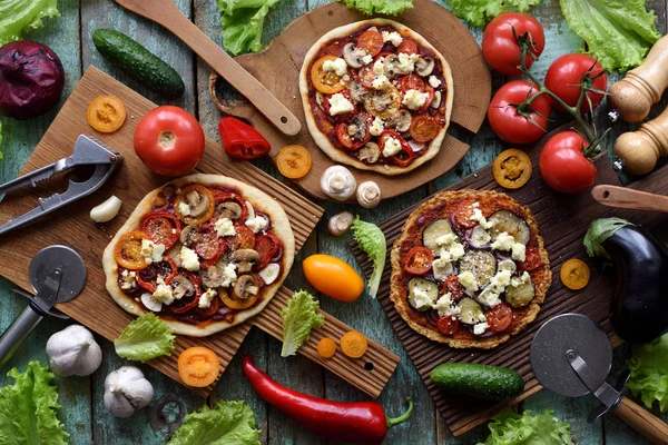 Meat free pizza party flat lay. Vegetarian pizzas on cauliflower