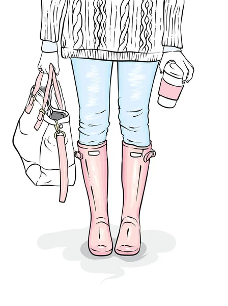 Stijlvolle rubberen laarzen, jeans, een tas en een trui. Vrouwelijke benen in stijlvolle kleding en schoenen. Vectorillustratie voor een briefkaart of een poster, print voor kleding. De lente of herfst. — Stockvector