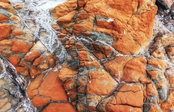 Primer Plano Fondo Textura Piedra Roja Costa Rocosa Del Mar — Foto de Stock