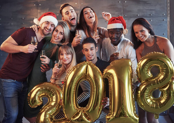 New 2018 Year is coming! Group portrait of Cheerful old friends communicate with each other. The party is devoted to the celebration of the new year. Concepts about youth togetherness lifestyle