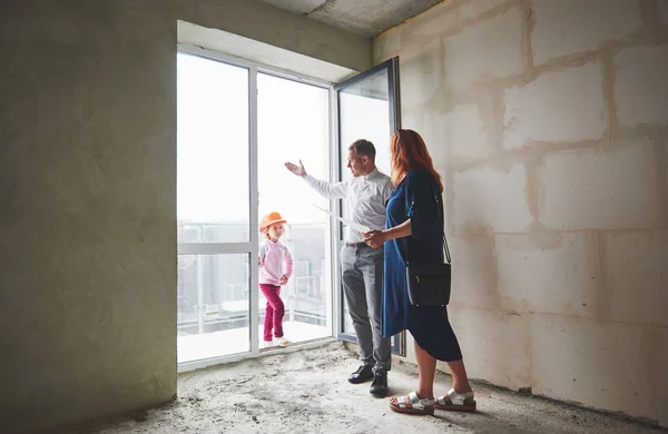 Engineer Showing Blueprint Her Client Woman Child Stock Photo