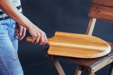 Wooden boards for pizza in hand woman.