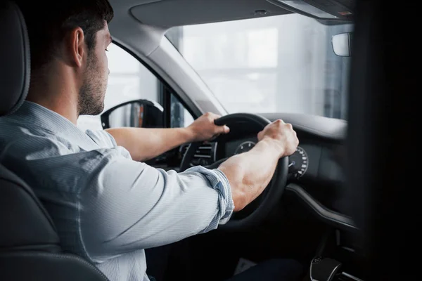 Young Man Sits Newly Bought Car Holding His Hands Rudder — Stock Photo, Image