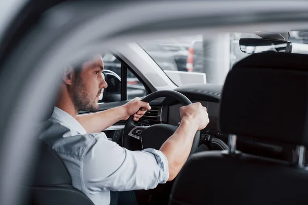 Young Man Sits Newly Bought Car Holding His Hands Rudder — Stock Photo, Image