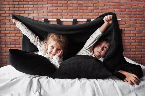 Little Children Boy Girl Laying Playing Pillows Bed Cover Blanket — 스톡 사진