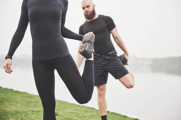 Fitness Couple Stretching Outdoors Park Water Young Bearded Man Woman — 图库照片